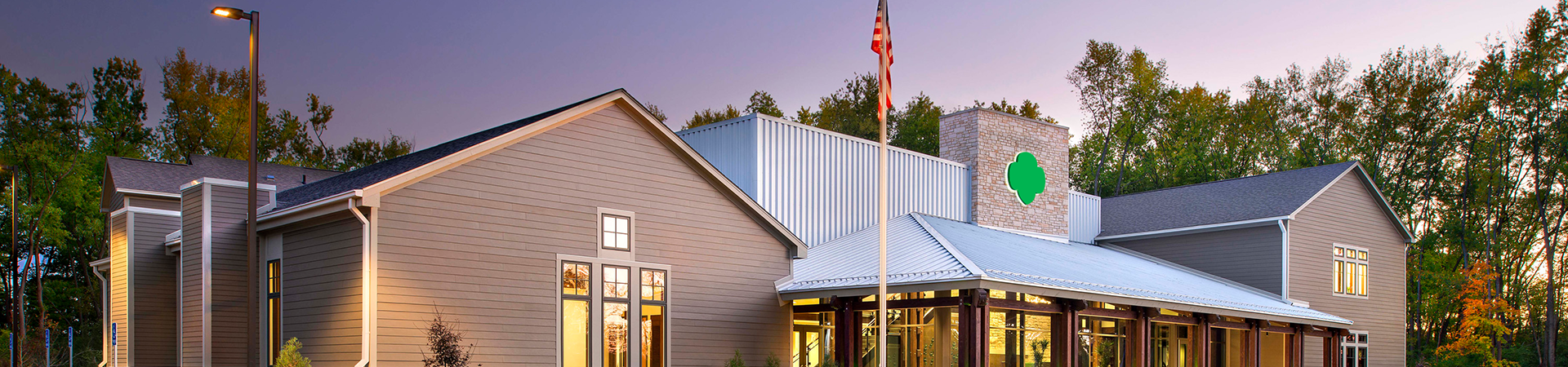  image of the outside of the Founders Lodge at dusk 